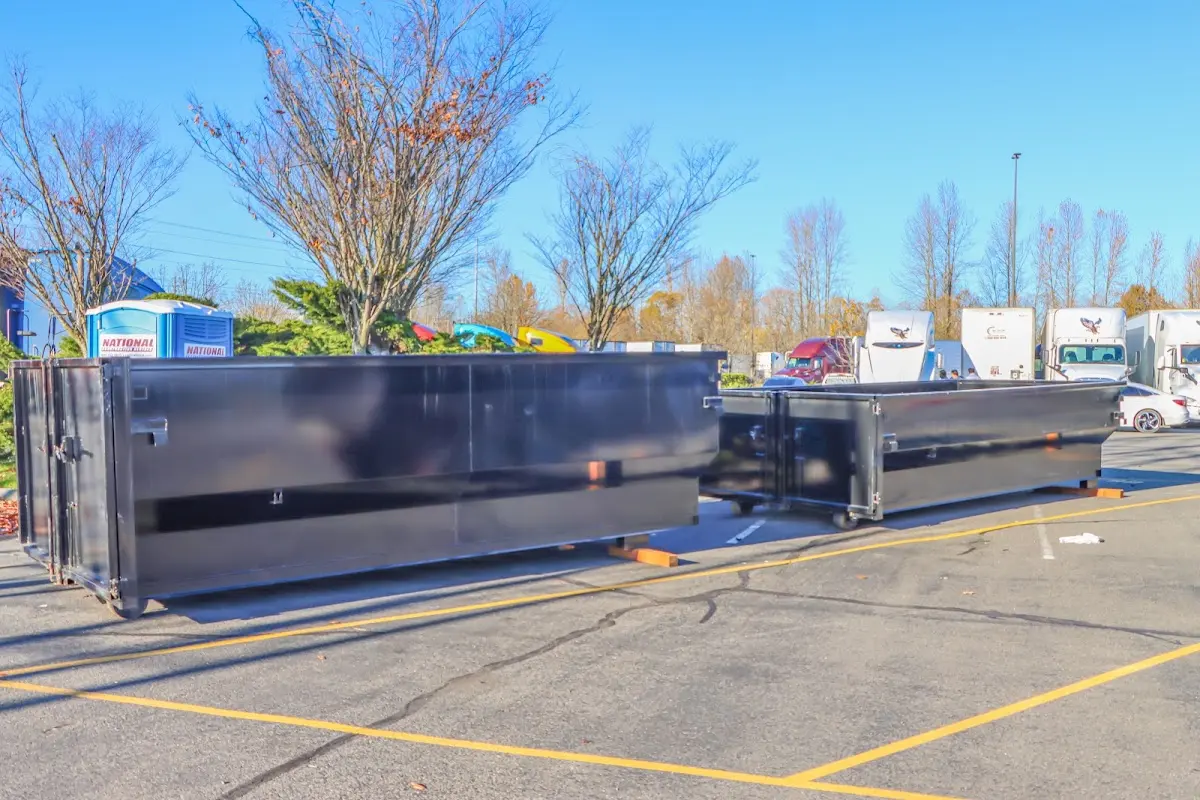 Professional dumpster rental service with roll-off container on residential driveway in Nolanville